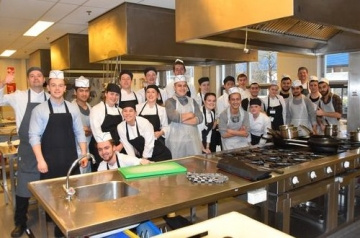 Groep koks in de keuken